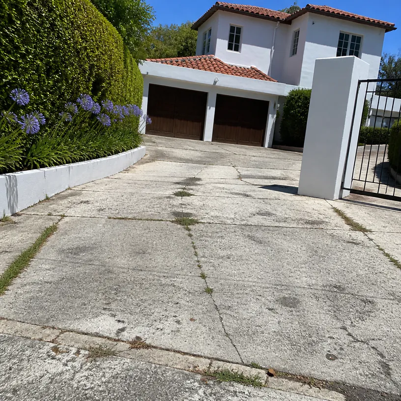 Before — the existing surface ahead of a driveway renewal